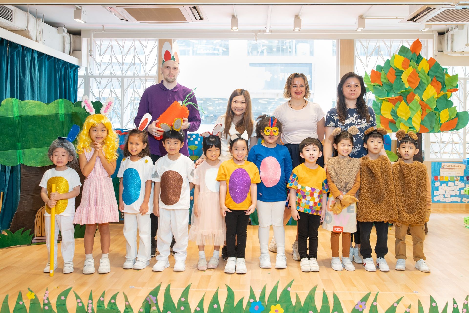 Mighty oaks Drama Performance with smiling teachers and kids in costume
