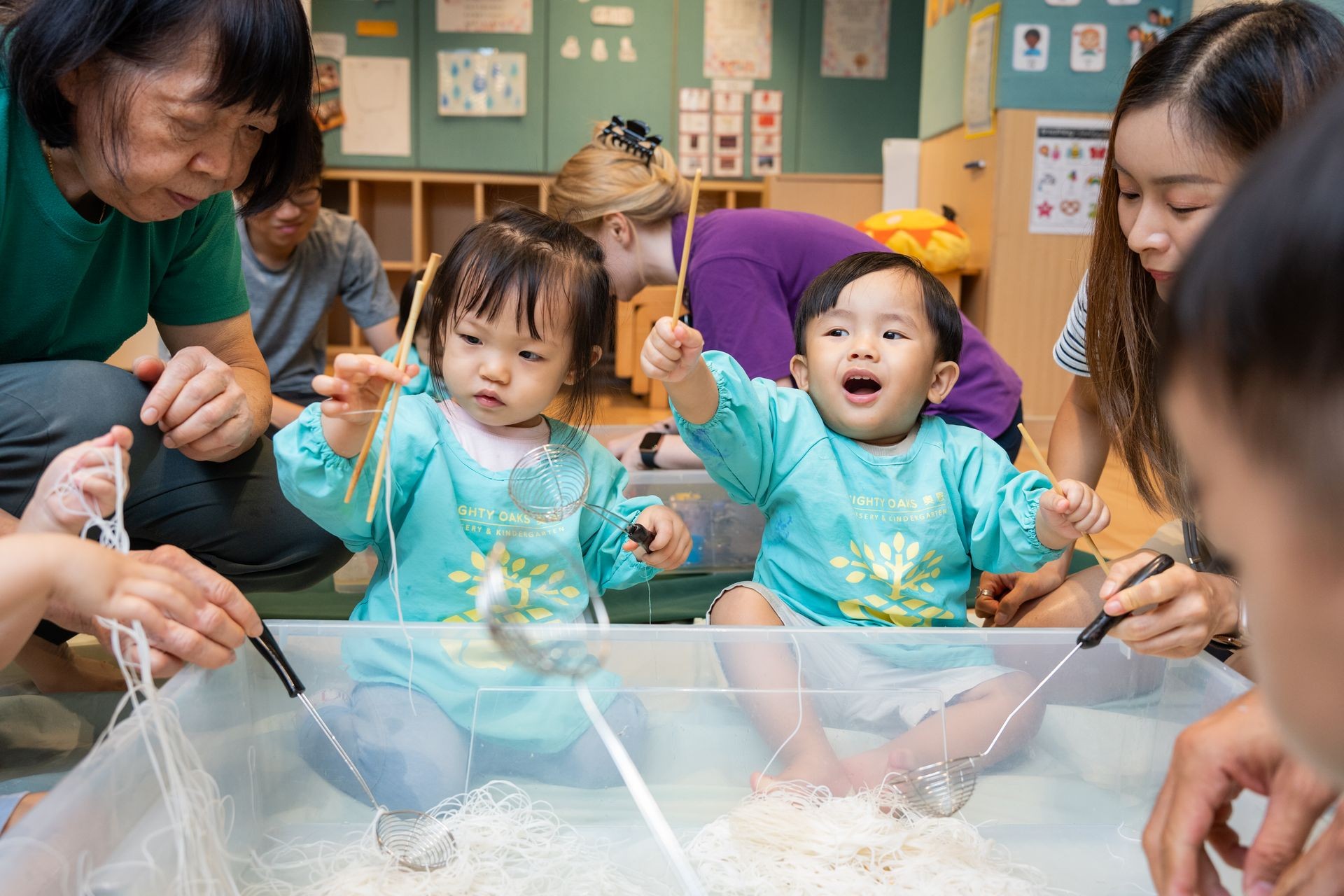  Children enjoying hands-on sensory play at Acorn Playgroup