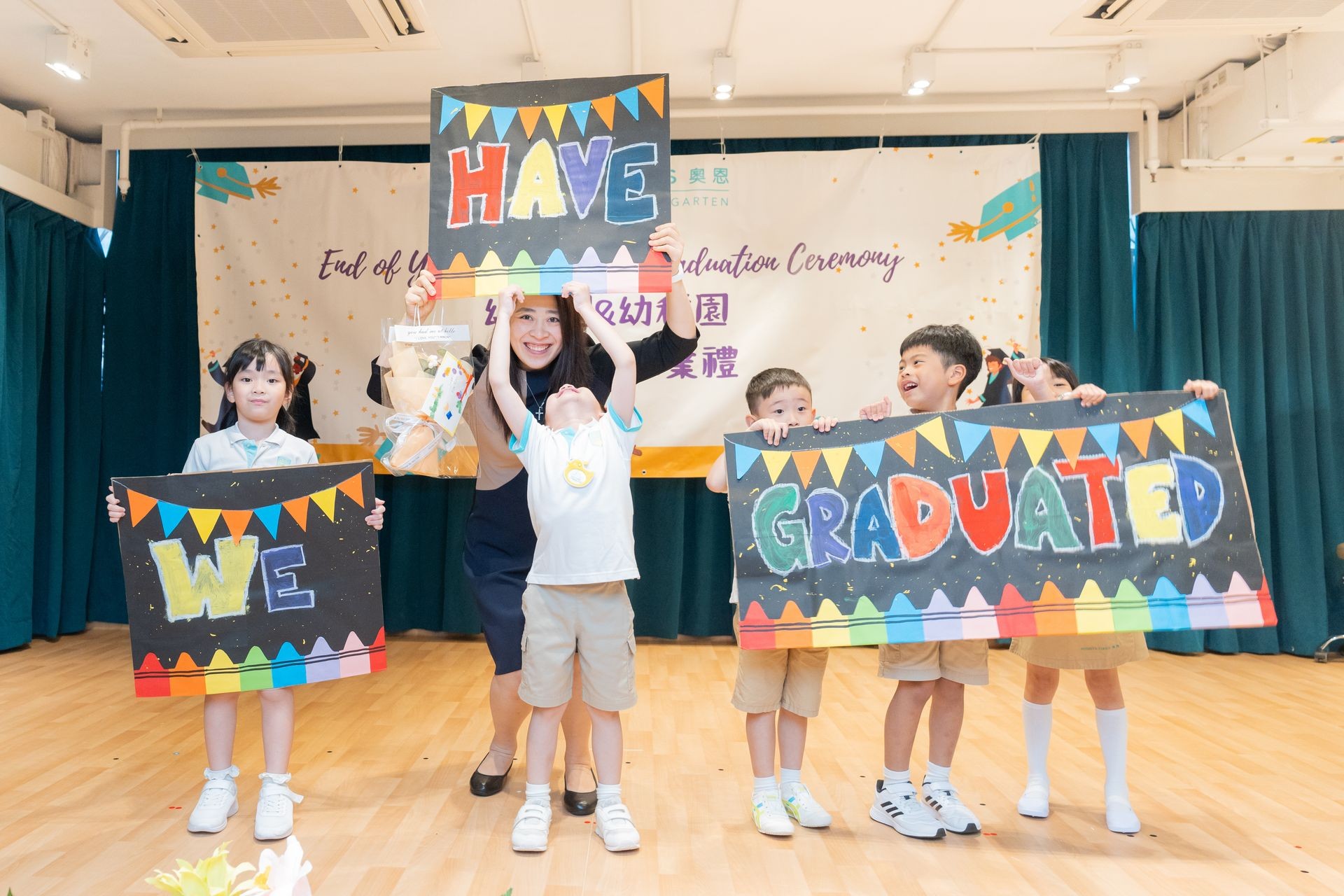 K3 graduates smiling at their graduation ceremony